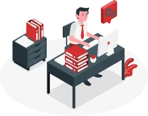 A man doing work at a desk with a desktop and books.